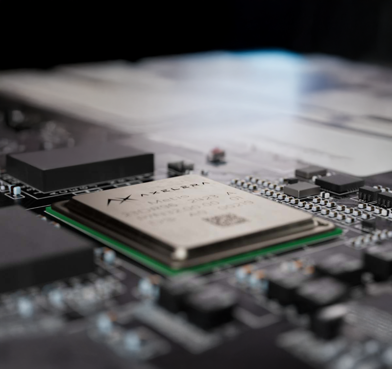 Axelera AI chip on a computer motherboard, surrounded by electronic components.