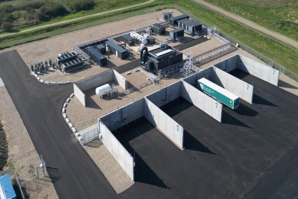 Aerial view of the Måde Power-to-X facility near the coast, featuring a wind turbine and industrial infrastructure supporting the FiBrane project’s seawater-to-UPW conversion for offshore green hydrogen production.
