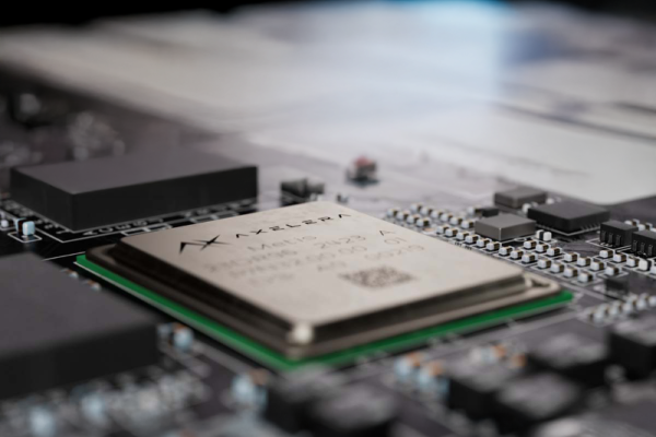Axelera AI chip on a computer motherboard, surrounded by electronic components.